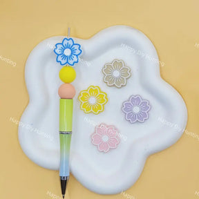 Multi-color outlined flower silicone focal beads for custom beaded pen making