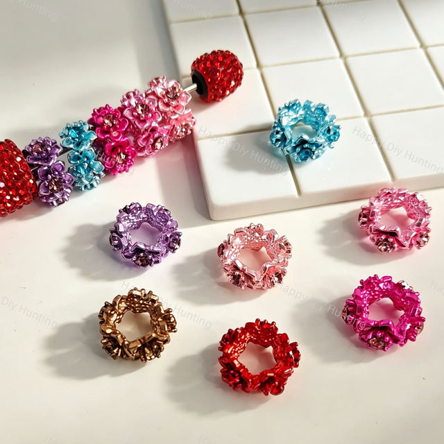 	Flower rhinestone metal bead caps and spacer findings designed to fit 18mm beads. Sturdy, shiny, and elegant, perfect for beadable pens, keychains, and handmade crafts.