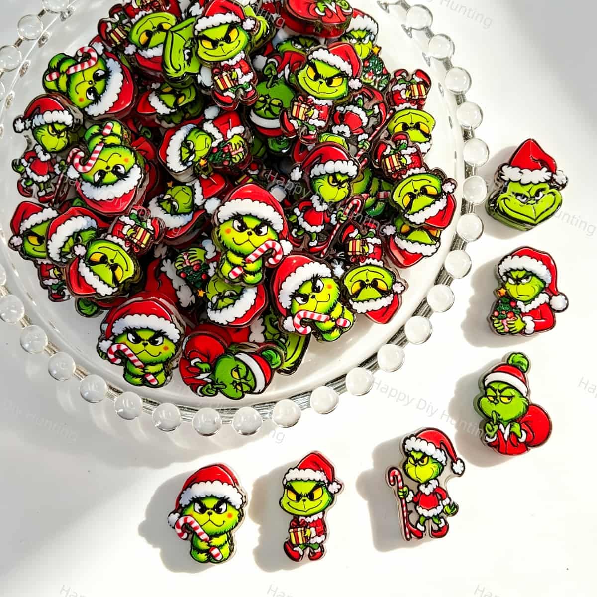 Acrylic focal beads featuring a green Christmas monster character print design. Lightweight, festive, and durable, perfect for beadable pens, keychains, and handmade holiday crafts.