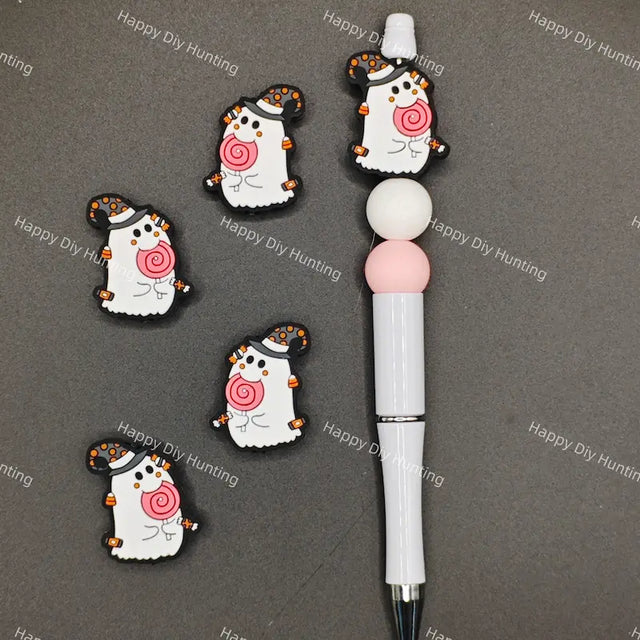 Halloween cartoon ghost silicone focal beads wearing polka dot witch hat and holding pink lollipop, match spacer beads for DIY handmade beadable pen holiday crafts.