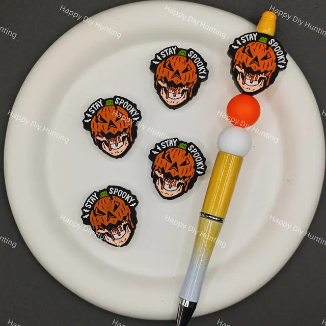 Halloween spooky jack o lantern silicone focal beads with "Stay Spooky" slogan, match spacer beads for DIY handmade beadable pen holiday crafts.