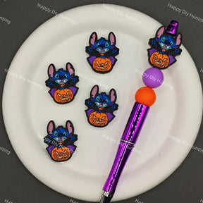 Halloween cartoon blue stitch silicone focal beads dressed as vampire with purple cape and jack o lantern pumpkin, match spacer beads for DIY handmade beadable pen holiday crafts.