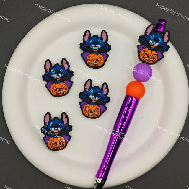 Halloween cartoon blue stitch silicone focal beads dressed as vampire with purple cape and jack o lantern pumpkin, match spacer beads for DIY handmade beadable pen holiday crafts.