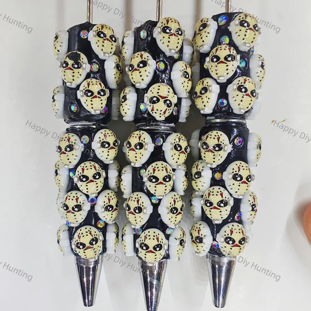 pre‑assembled hockey‑style horror mask 3D figurine beadable pens, black base with embedded sparkling rhinestones, spooky halloween themed craft ballpoint pens bulk