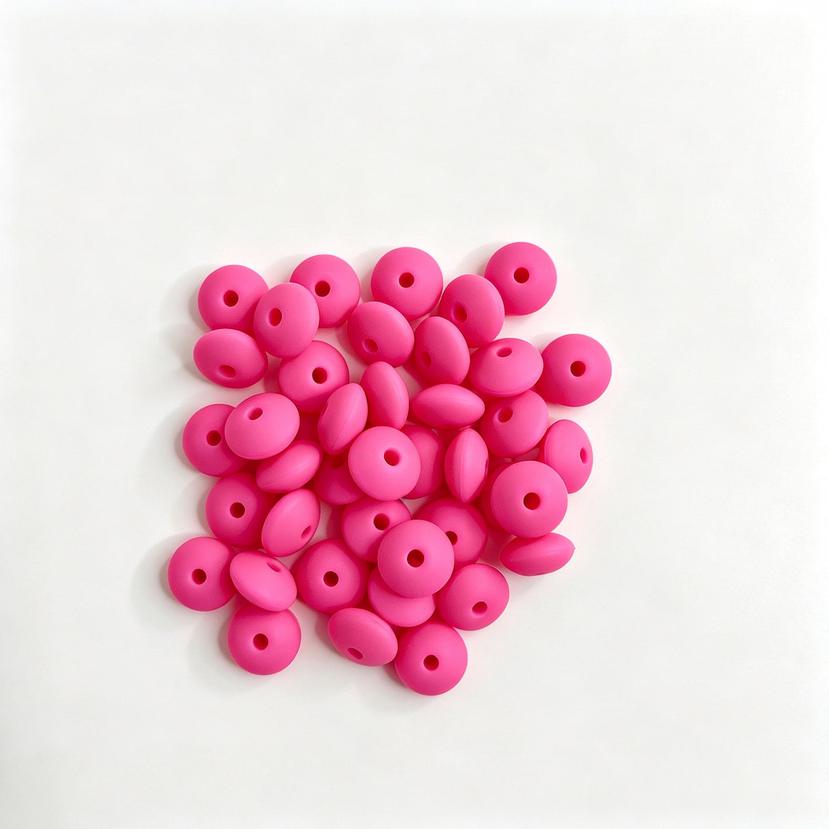 Hot pink round acrylic spacer beads. Smooth, lightweight, and colorful, perfect for beadable pens, keychains, and handmade crafts