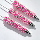 Hot pink beadable pen featuring a decorative bow and sparkling rhinestones. Refillable and customizable, perfect for DIY crafts and handmade gifts.