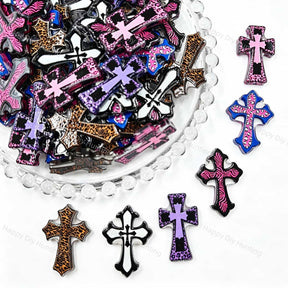 Cross-shaped acrylic focal beads featuring a mix of leopard and zebra animal prints. Lightweight, stylish, and durable, perfect for beadable pens, keychains, and handmade crafts.