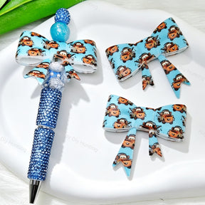 Bow-shaped silicone focal beads featuring a light blue cute cartoon tow truck print design. Soft, durable, and flexible, perfect for beadable pens, keychains, and handmade crafts.