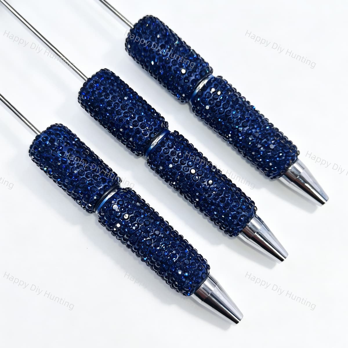 Three midnight blue rhinestone beadable pens displayed on a white surface. Each pen features a midnight blue rhinestone-encrusted barrel and a silver metal tip. Perfect for DIY beadable pen projects, custom crafts, and handmade gifts.
