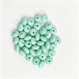 Mint green round acrylic spacer beads. Smooth, lightweight, and colorful, perfect for beadable pens, keychains, and handmade crafts.