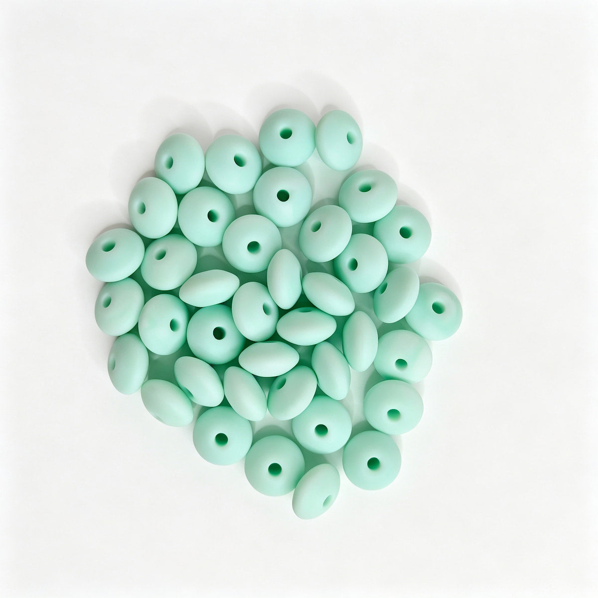 Mint green round acrylic spacer beads. Smooth, lightweight, and colorful, perfect for beadable pens, keychains, and handmade crafts.