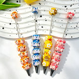 Four mixed cartoon animal character beadable pens displayed on a white wavy tray. Designs include an orange tiger, a blue bunny, a yellow bear with honey and bee details, and a pink pig, each decorated with faux pearls and silver metal tips. Perfect for DIY crafts, focal beads, and handmade gifts.