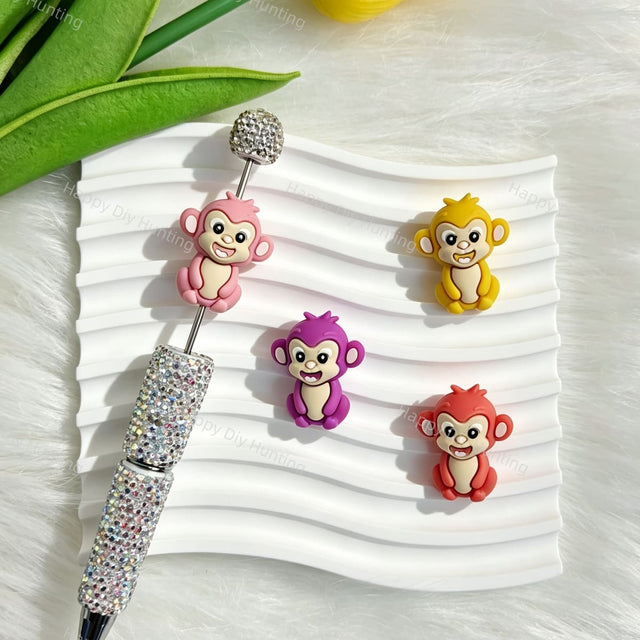 Silicone focal beads featuring a multi color cute monkey 3D design. Soft, durable, and flexible, perfect for beadable pens, keychains, and handmade crafts.