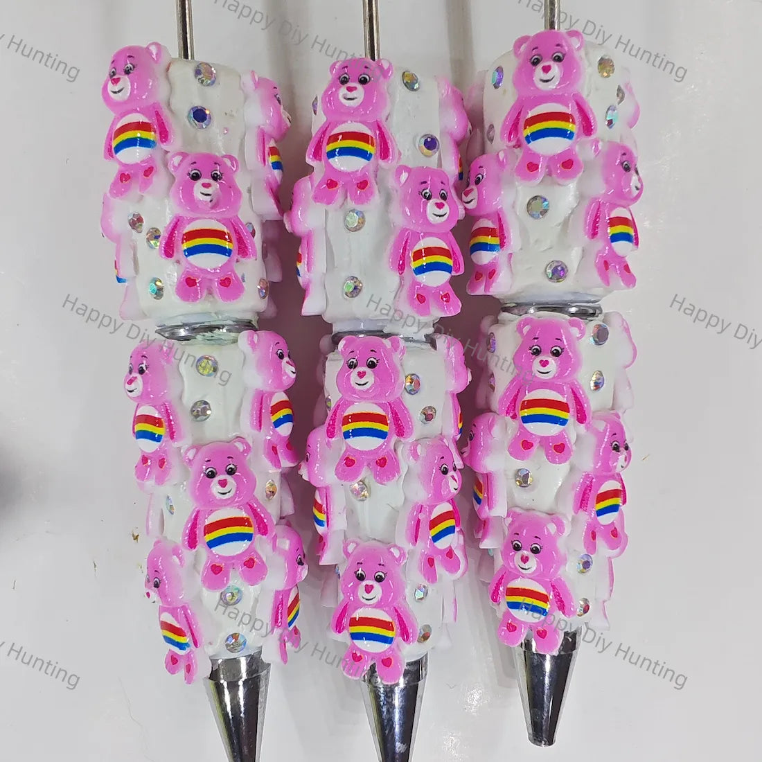 pre‑assembled pink stacked 3D rainbow‑belly bear figurine beadable pens with embedded sparkling rhinestones bulk cute themed craft ballpoint pens