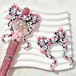 Bow-shaped silicone focal beads featuring a pink cartoon cow and daisy print design. Soft, durable, and flexible, perfect for beadable pens, keychains, and handmade crafts