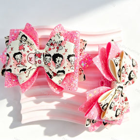 Pink layered glitter bow beads featuring a cartoon print design. Lightweight, sparkly, and smooth, perfect for beadable pens, keychains, and handmade crafts.