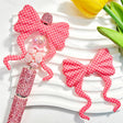 Silicone bow beads featuring a pink polka dot print design. Soft, durable, and flexible, perfect for beadable pens, keychains, and handmade crafts.