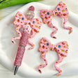 Bow-shaped silicone focal beads featuring a pink striped cute cartoon monster design. Soft, durable, and flexible, perfect for beadable pens, keychains, and handmade crafts.