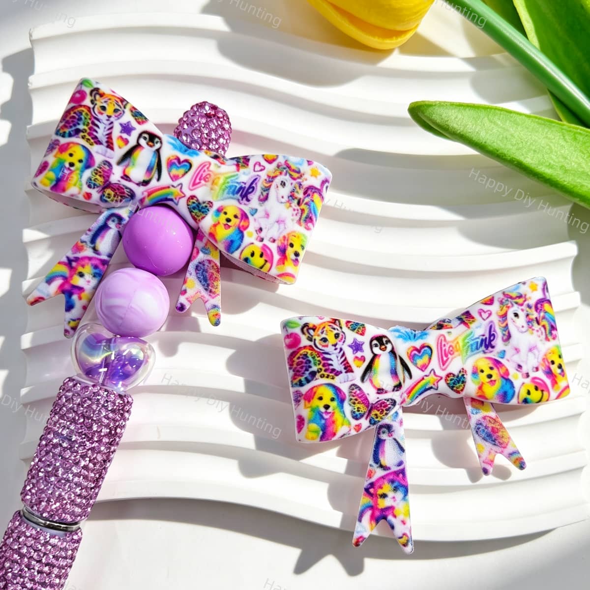 Bow-shaped silicone focal beads featuring a rainbow cute animal print design. Soft, durable, and flexible, perfect for beadable pens, keychains, and handmade crafts.