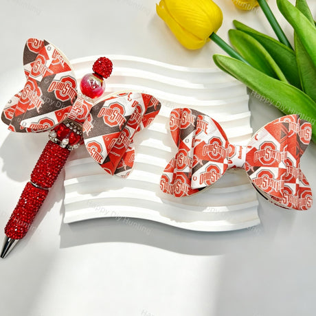 Bow-shaped silicone focal beads featuring a red and gray team-inspired design. Soft, durable, and flexible, perfect for beadable pens, keychains, and handmade crafts.