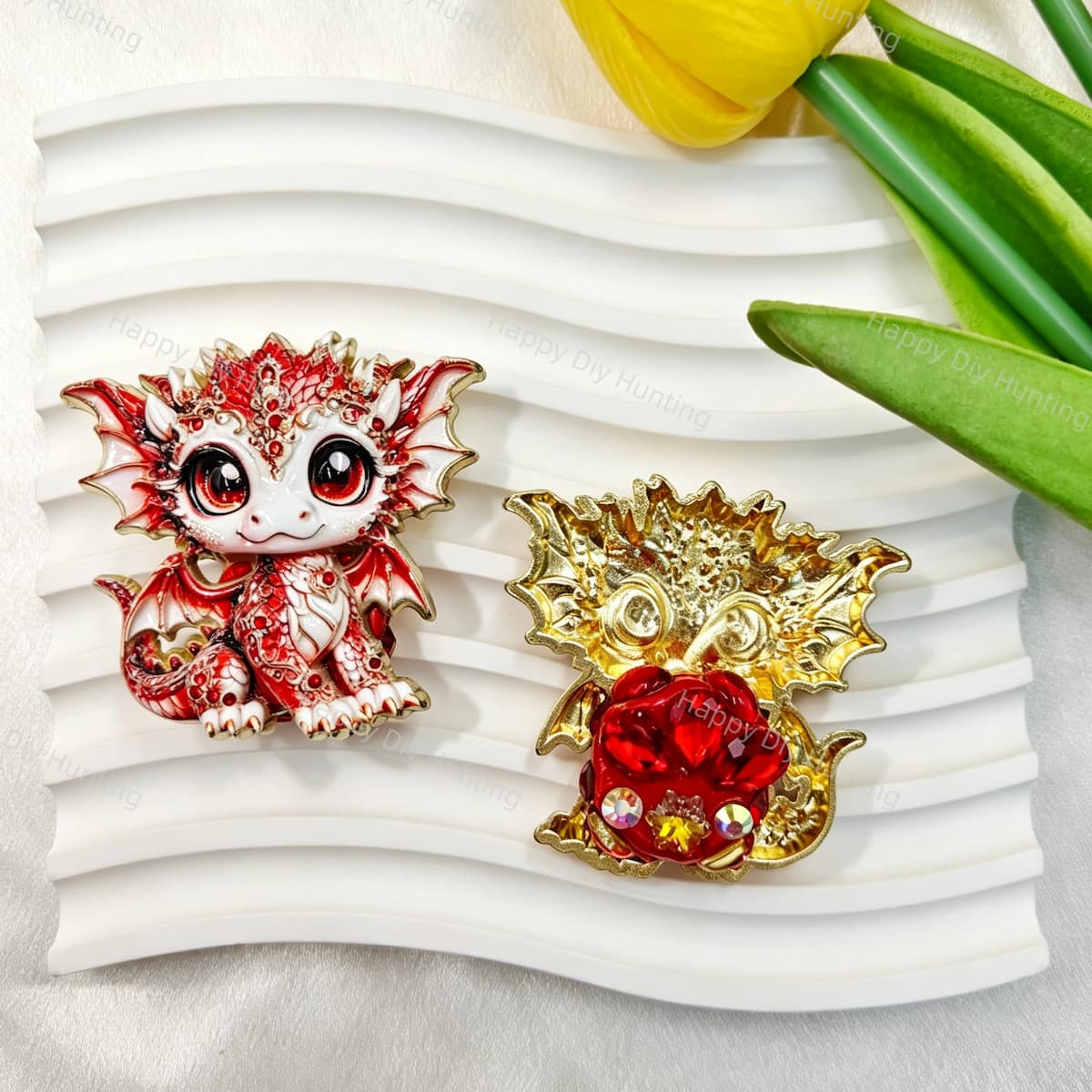 Red cute baby dragon metal fancy bead with rhinestones shown from the front and back. The front features a detailed red and white baby dragon with big eyes and rhinestone accents, while the back shows gold metal wings with a red crystal flower center. Perfect for DIY beadable pens and crafts.