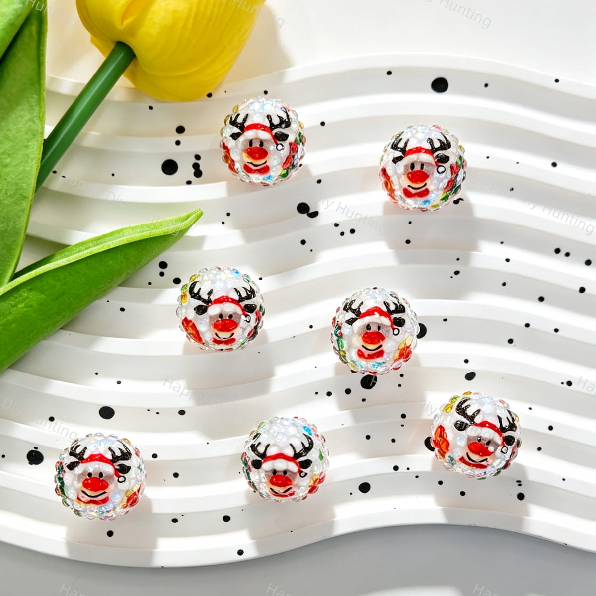 Clear acrylic beads featuring a red nose reindeer wearing a Santa hat, with black antlers, a red scarf, and colorful candy dots on a faceted rhinestone surface. Perfect for DIY beadable pens, keychains, and handmade holiday crafts.