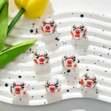 Clear acrylic beads featuring a red nose reindeer wearing a Santa hat, with black antlers, a red scarf, and colorful candy dots on a faceted rhinestone surface. Perfect for DIY beadable pens, keychains, and handmade holiday crafts.