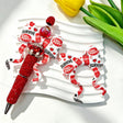 Bow-shaped silicone focal beads featuring a red and white soda brand print design. Soft, durable, and flexible, perfect for beadable pens, keychains, and handmade crafts.