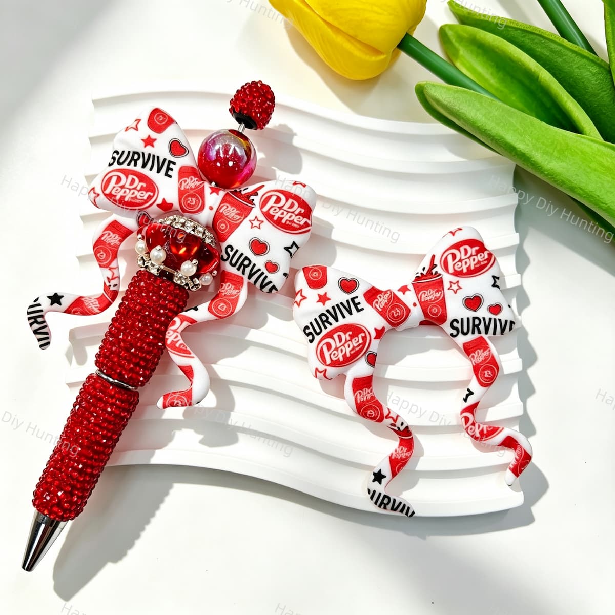 Bow-shaped silicone focal beads featuring a red and white soda brand print design. Soft, durable, and flexible, perfect for beadable pens, keychains, and handmade crafts.