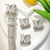 Silver metal fancy beads featuring a designer V*L letter design with a rhinestone border, displayed with a silver rhinestone beadable pen. Sturdy, shiny, and glamorous, perfect for beadable pens, keychains, and handmade crafts.