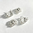Silver plated hollow bow-shaped bead caps and spacer findings. Lightweight, shiny, and durable, perfect for beadable pens, keychains, and handmade crafts.