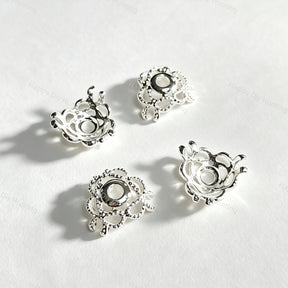 Silver plated hollow bow-shaped bead caps and spacer findings. Lightweight, shiny, and durable, perfect for beadable pens, keychains, and handmade crafts.