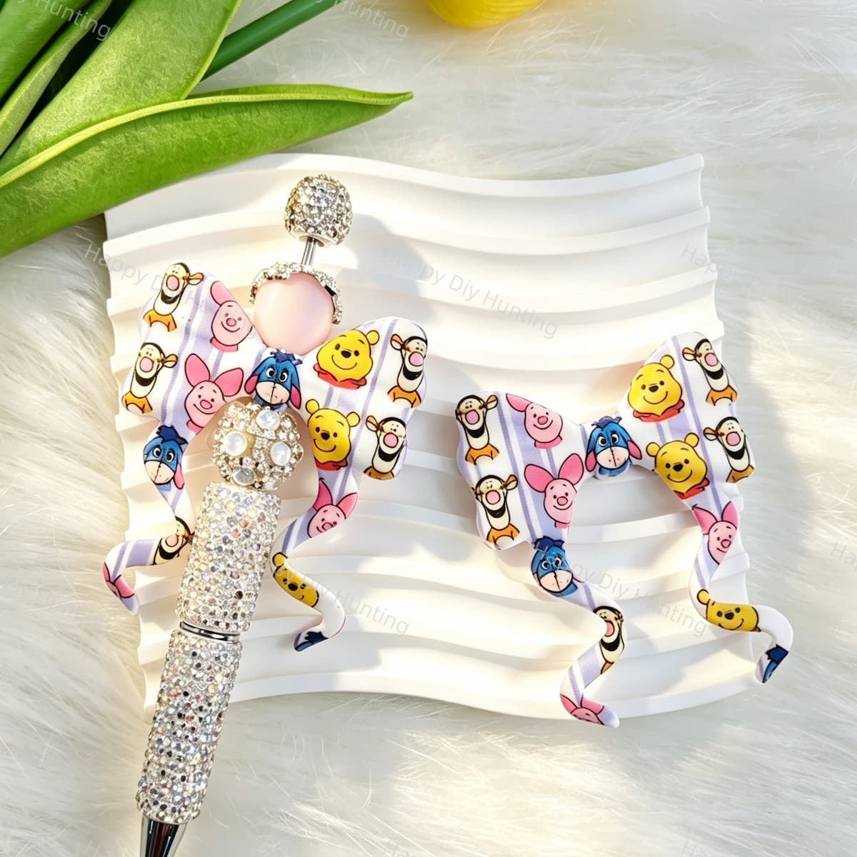 Bow-shaped silicone focal beads featuring colorful striped cartoon animal designs. Soft, durable, and flexible, perfect for beadable pens, keychains, and handmade crafts.