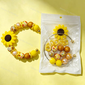 Sunflower complete beadable metal bracelet DIY craft kits, including metal bracelet bases, sunflower focal beads, silicone beads, and spacer beads. Perfect for handmade gift making, craft fair retail, and custom jewelry creation