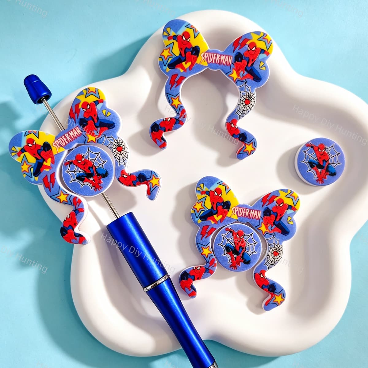 Bow-shaped silicone focal beads featuring a fun superhero character print design. Soft, durable, and flexible, perfect for beadable pens, keychains, and handmade crafts.