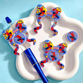 Bow-shaped silicone focal beads featuring a fun superhero character print design. Soft, durable, and flexible, perfect for beadable pens, keychains, and handmade crafts.