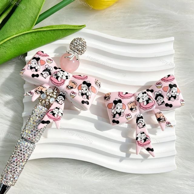 Pink bow-shaped silicone focal beads featuring a sweet cartoon bunny design. Soft, durable, and flexible, perfect for beadable pens, keychains, and handmade crafts.