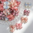 Acrylic focal beads featuring a vintage floral glitter bow print design. Lightweight, sparkly, and durable, perfect for beadable pens, keychains, and handmade crafts.