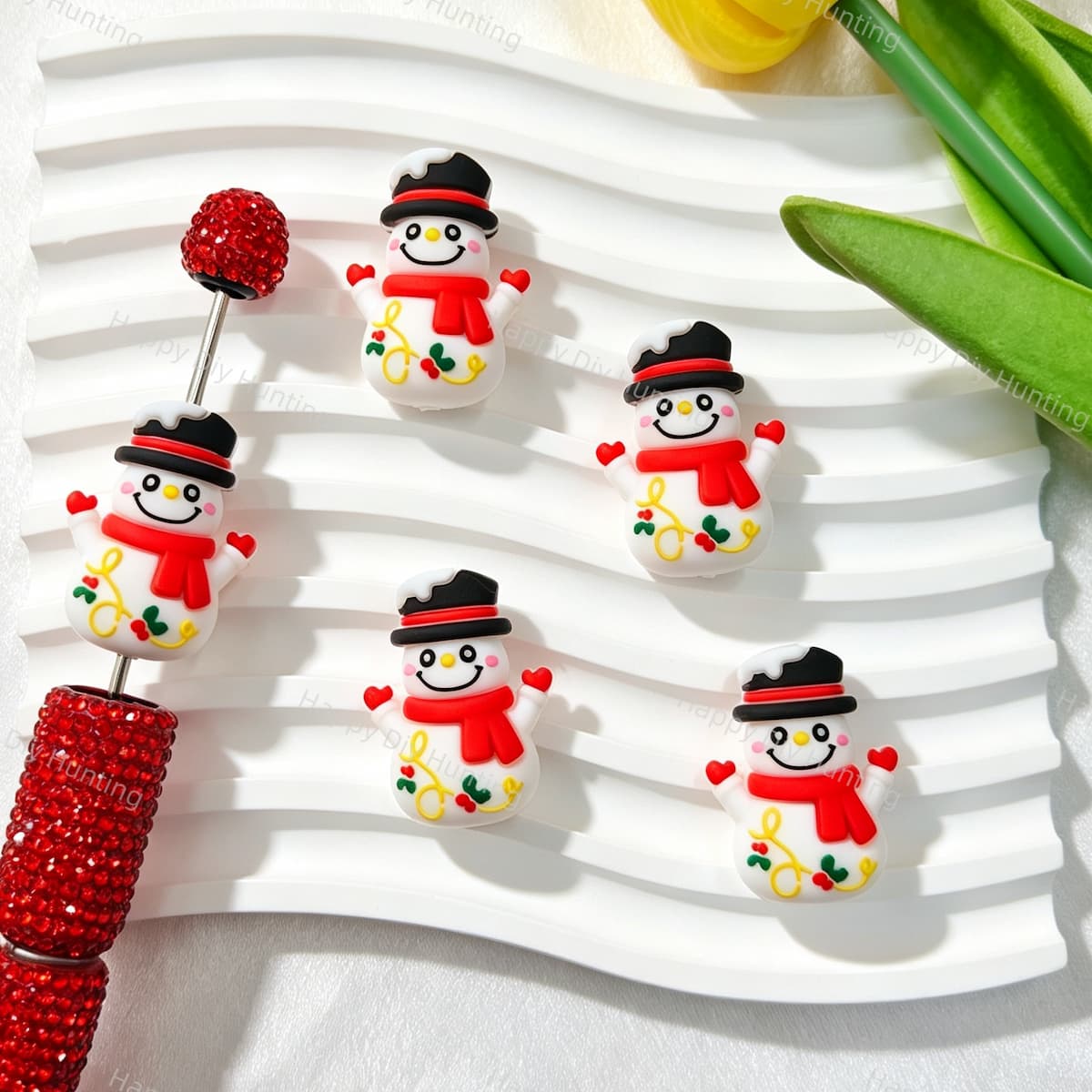 White Christmas 3D snowman silicone focal beads featuring a cute three-dimensional snowman design with a black hat, red scarf, and holly details. Soft, durable, and flexible, perfect for beadable pens, keychains, and handmade holiday crafts.