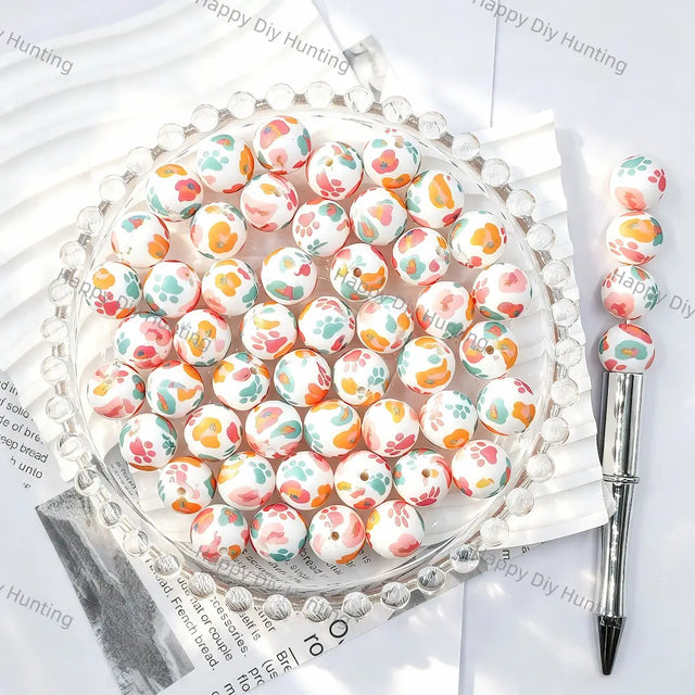 White base full print round silicone beads with pastel multicolor cat paw print patterns for diy handmade beadable pen wholesale craft jewelry accessories