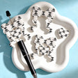 Bow-shaped silicone focal beads featuring a white and black CC print design. Soft, durable, and flexible, perfect for beadable pens, keychains, and handmade crafts.