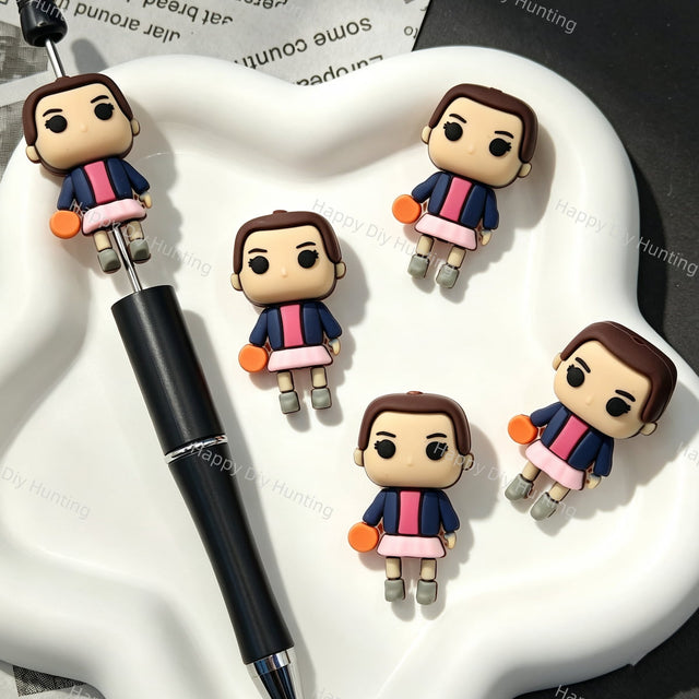 Ball‑holding cartoon girl 3D silicone focal beads, cute 3‑dimensional girl character silicone beads for beadable pens and DIY keychain craft projects.