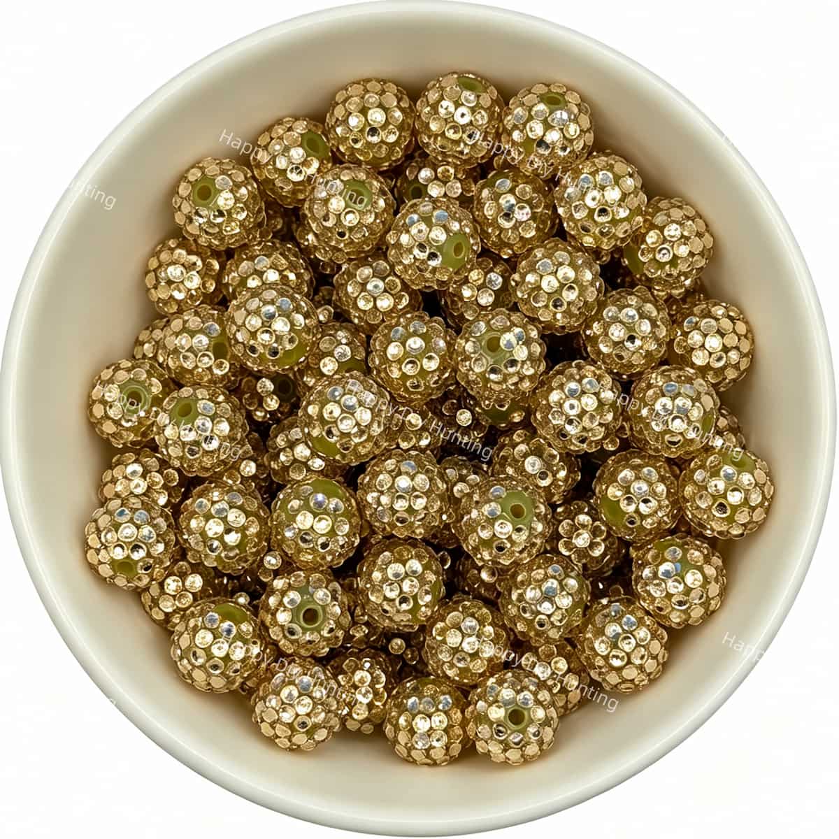 Gold rhinestone beads in matte white bowl, white background, top‑down view, high‑resolution product photo