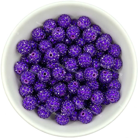 Purple rhinestone beads in matte white bowl, white background, top‑down view, high‑resolution product photo