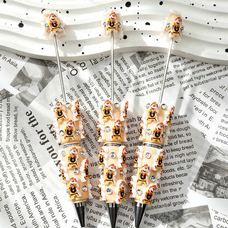 Beige little boy relief beadable pens, raised cartoon boy motifs with white trim and multi‑color rhinestones, diy craft pen blanks