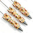 Beige little boy relief beadable pens, raised cartoon boy motifs with white trim and multi‑color rhinestones for diy handmade stationery