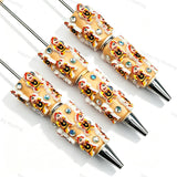 Beige little boy relief beadable pens, raised cartoon boy motifs with white trim and multi‑color rhinestones for diy handmade stationery