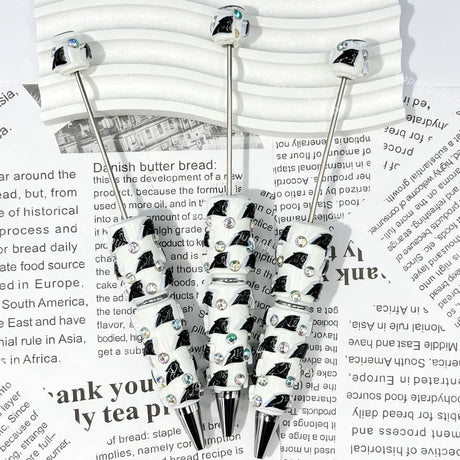 close-up black panther CP football beadable pen showing panther design and beadable barrel