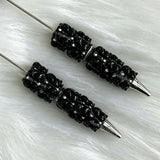 close-up black Richard beadable pen showing colorful Richard design and beadable barrel