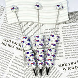close-up blue-red running bison BB football beadable pen showing bison design and beadable barrel